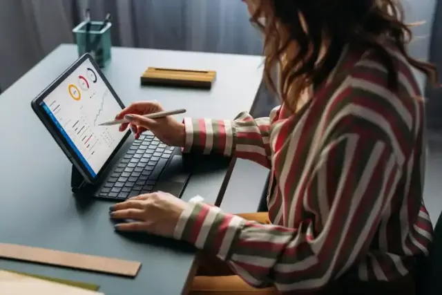 Data analysis on a tablet at a designer charrette, focusing on modern collaboration and creative design insights for architectural and interior design projects.