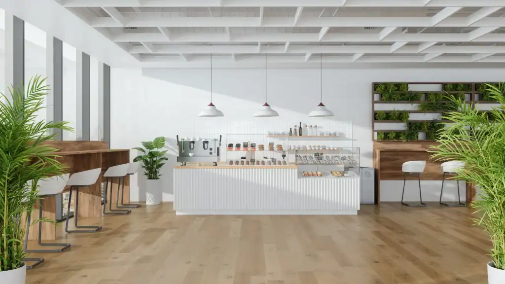 Modern café interior with minimalist design, white walls, wooden accents, green plants, and a clean pastry display focusing on innovative designer charrette concepts.